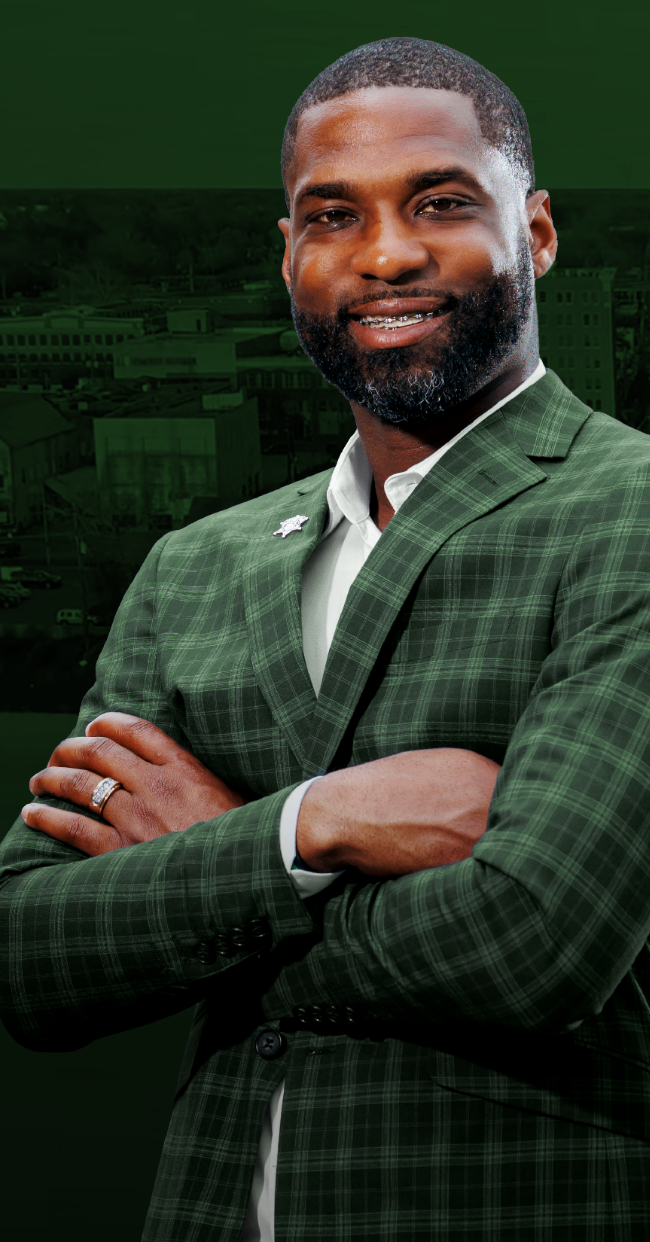 Chris Lewis, candidate for Monroe City Marshal, over the Monroe skyline